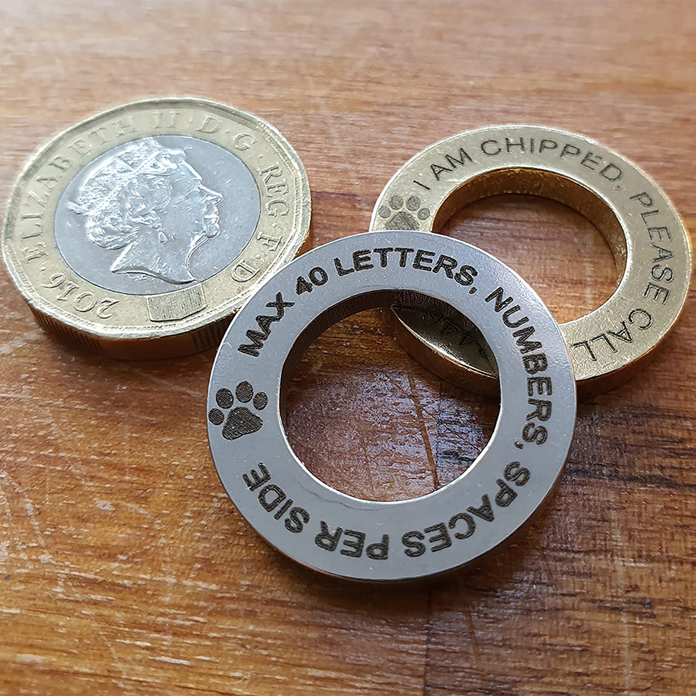 Pet ID Tag showing the size 24mm next to a UK one pound coin Pet ID Tag showing the size 24mm next to a UK one pound coin