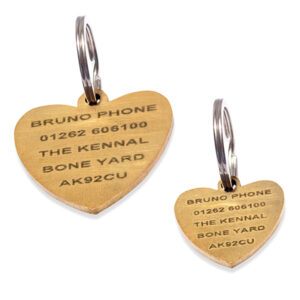 Love heart shaped dog ID tags made from brass with a brushed finish - each engraved with pet details