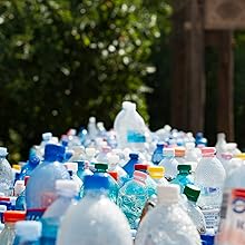 Collection of plastic bottles representing recycled materials used in the manufacture of Vet Bedding dog bedding.