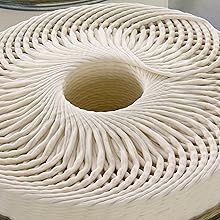 Rolled white polyester fibre sliver used in the manufacturing process of Vetbed material.