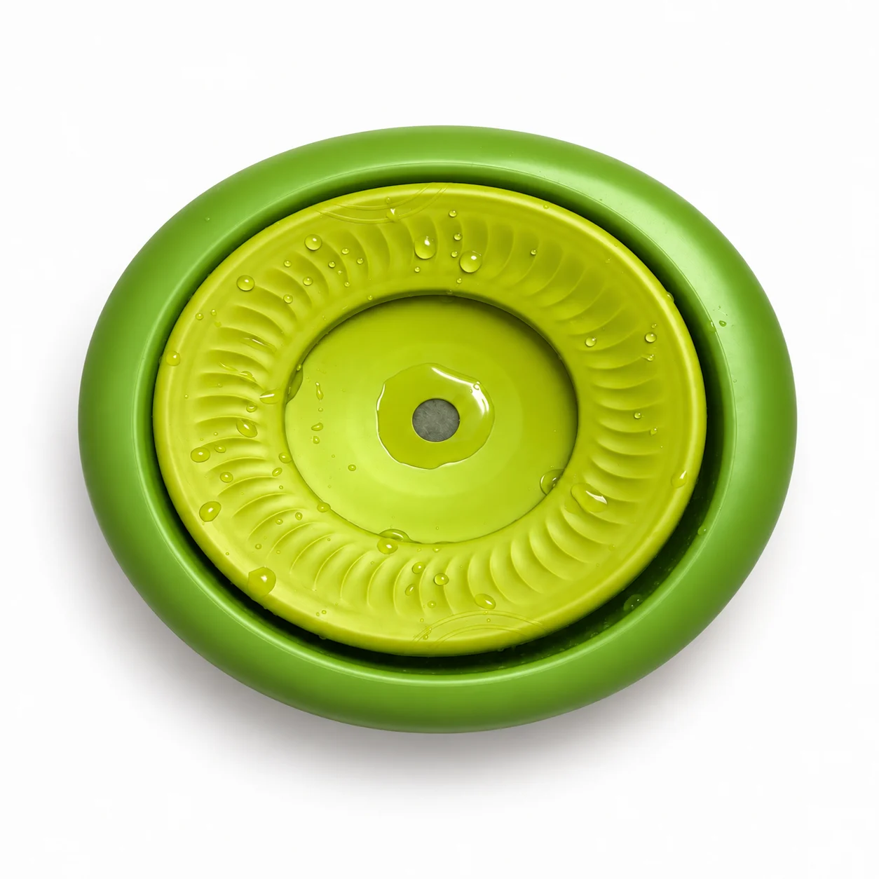 The green Hungry Henry Oval Floating Water Bowl photographed from above, showing the floating plate and central drinking dip