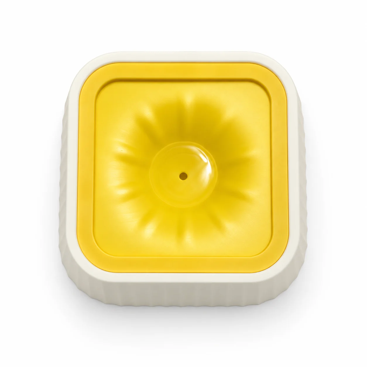 The Hungry Henry Square Floating Water Bowl with a yellow insert, photographed from above showing the ivory shell